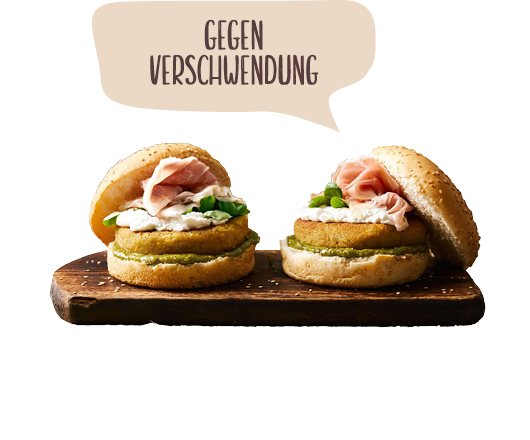 Kichererbsen-brokkoli-hamburger mit karottenblatt-pesto, ziegenkäse und San Daniele Schinken